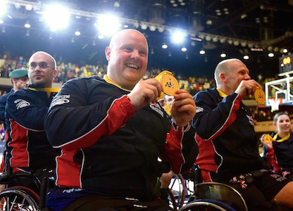 Invictus Games Athletes holding medal at 2014 Invictus Games