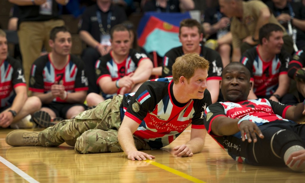 Source: Royal Central & Prince Harry to Make Speech at Invictus Games Team Trials. Prince Harry of Wales reacts to a scoring play during an exhibition volleyball match between U.S. and U.K. wounded warrior volleyball teams during the Warrior Games here May 11. Olympic gold medalists Misty May-Treanor, Missy Franklin and Paralympic medalists Kari Miller and Brad Snyder were in attendance to support the wounded athletes. From May 11-16, more than 200 wounded, ill and injured service members and veterans from the U.S. Marines, Army, Air Force and Navy, as well as a team representing U.S. Special Operations Command and an international team representing the United Kingdom, will compete for the gold in track and field, shooting, swimming, cycling, archery, wheelchair basketball and sitting volleyball at the U.S. Olympic Training Center and U.S. Air Force Academy here. The military service with the most medals will win the Chairman's Cup. (U.S. Marine Corps photo by Sgt. Tyler L. Main / Released)